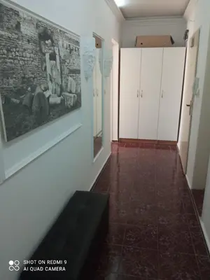a room with a couch and a painting on the wall at International 2-star spacious 88 sq m apartment in Varna City