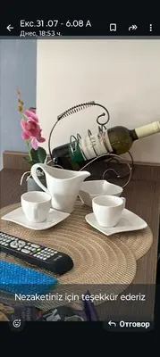 a picture of a table with dishes and a wine bottle at Slavi studios Aparthotel Exselsior, Sunny beach in Sunny Beach