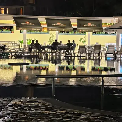 a group of people sitting at tables in a restaurant at Slavi studios Aparthotel Exselsior, Sunny beach in Sunny Beach