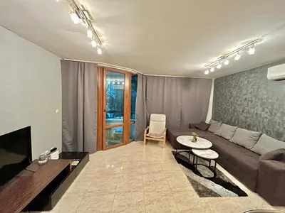 a living room with a couch and a table at Black Sea Varna Centre in Varna City