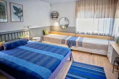 a bedroom with two beds and a window at Villa Mare Boutique Guesthouse by Flat Mаnаger in Pomorie