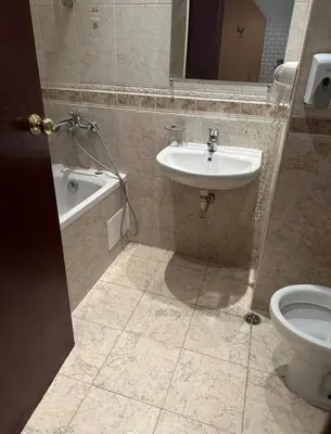 a bathroom with a sink and a tub and a toilet at Miramar Apartment in Sunny Beach
