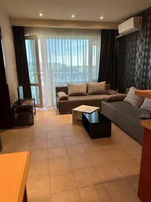 a living room with a couch and a table at Miramar Apartment in Sunny Beach