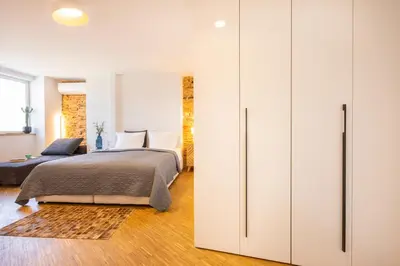 a bedroom with a bed and a closet at Apartment Musala N 01 in Varna City