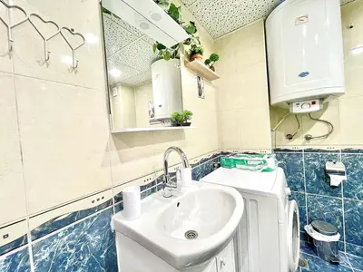 a bathroom with a sink and a mirror at Glarus in Varna City
