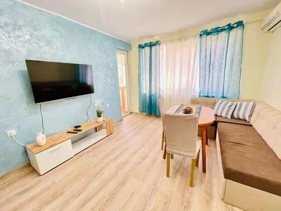 a living room with a couch and a table at Glarus in Varna City