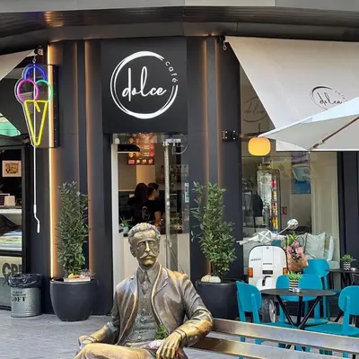 a statue of a man sitting in front of a store at Apartment Musala N 02 in Varna City