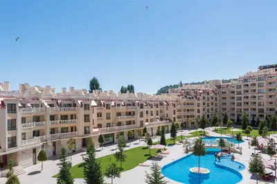 an aerial view of a large apartment complex with two pools at Varna Beach Apartment in Varna City