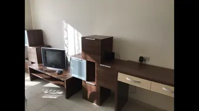 a room with a desk with a computer and a tv at Lozenetz Beach Apartments in Lozenets