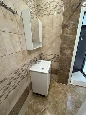 a bathroom with a sink and a mirror at Lozenetz Beach Apartments in Lozenets