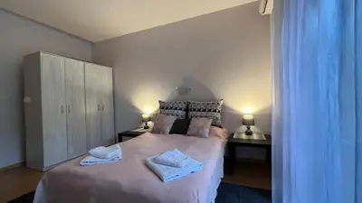 a bedroom with a large bed with towels on it at Holiday Fort Golf Club & Orchid Fort Noks MIA in Sunny Beach