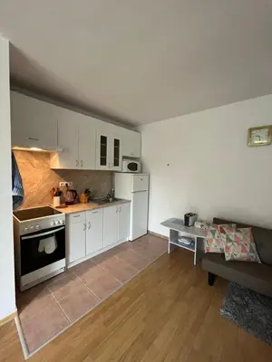 a kitchen with white cabinets and a stove at Holiday Fort Golf Club & Orchid Fort Noks MIA in Sunny Beach