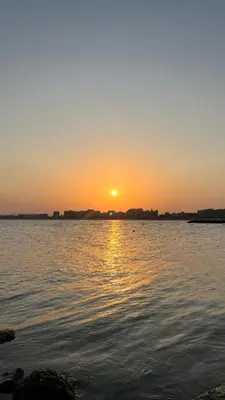 a sunset over a large body of water at Holiday Fort Golf Club & Orchid Fort Noks MIA in Sunny Beach