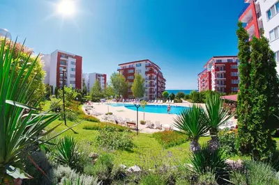 an outdoor swimming pool in a city with tall buildings at Orchid Fort Noks Design in Sunny Beach