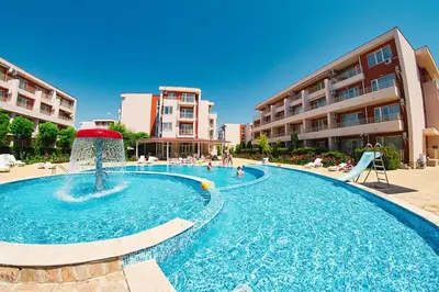 a swimming pool with a fountain in a resort at Orchid Fort Noks Design in Sunny Beach