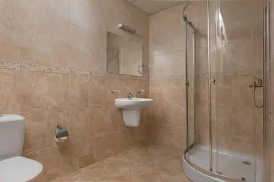 a bathroom with a shower and a sink and a toilet at Апартамент Del View гр Приморско in Primorsko