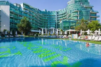 a large swimming pool in front of a large building at Апартамент Del View гр Приморско in Primorsko
