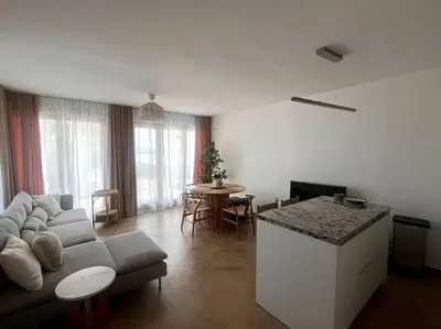 a living room with a couch and a table at Panorama Bay-Serenity Haven in Burgas City