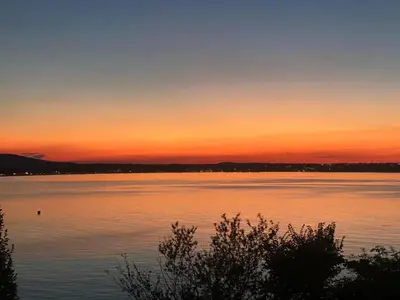 a sunset over a large body of water at Santa Marina Sun&Sea Haven in Sozopol