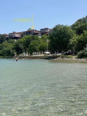 a body of water with a city in the background at Santa Marina Sun&Sea Haven in Sozopol