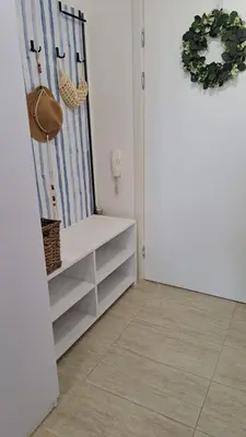 a room with a white cabinet and a door at Vladan apartments in Sozopol
