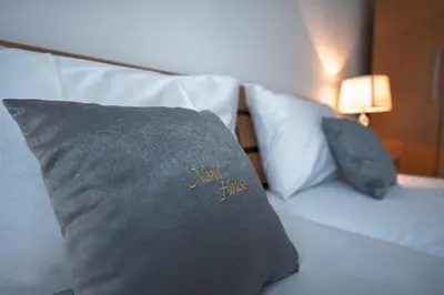 a bed with two pillows on it in a room at Apartment NORA in Sunny Beach
