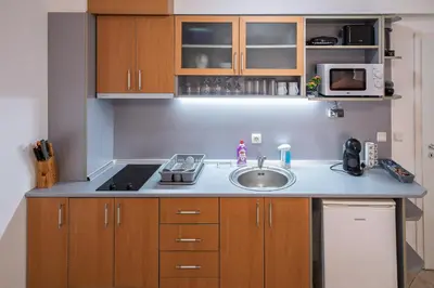 a kitchen with a sink and a microwave at Apartment NORA in Sunny Beach