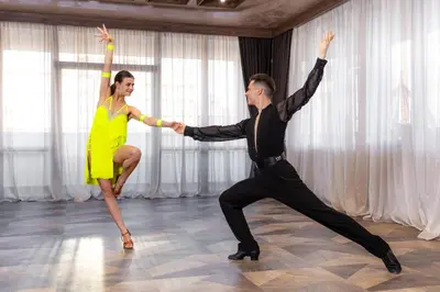 a man and a woman dancing in a room at Noma Boutique Hotel - Adults only in Sunny Beach