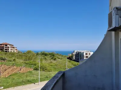 a view of the ocean from the side of a building at SunBreeze Living Apartments in Byala