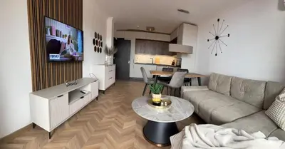 a living room with a couch and a table at SeaView Etara IV Apartment in Sveti Vlas in Sveti Vlas