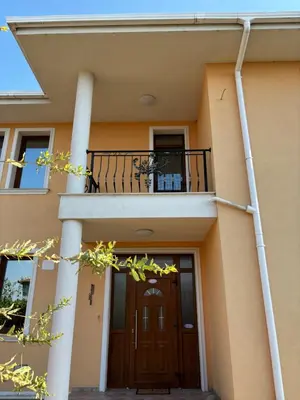a house with a balcony and a door at Rose Villa in Trŭstikovo