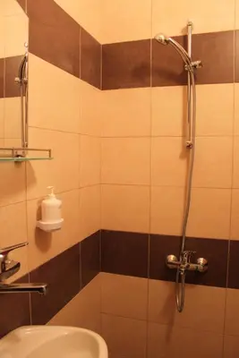 a bathroom with a shower and a sink at Megi Apartments in Sozopol