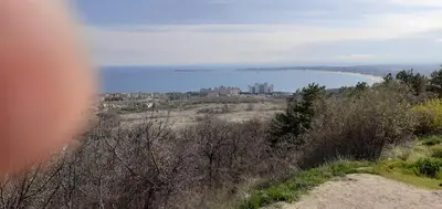 a view of a lake with a city in the distance at Sunshine Byala 2 in Byala