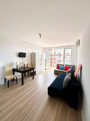 a living room with a couch and a table at 17 pools in Fort Noks Grand in Sveti Vlas