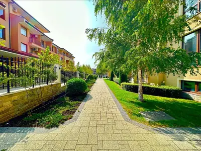 a brick walkway in front of a building at Menada Sea Dreams Apartments in Sveti Vlas