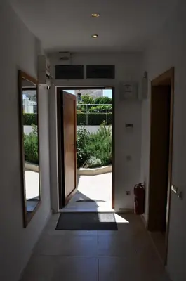 an empty hallway with an open door to a yard at Villa Sun Village Byala in Byala