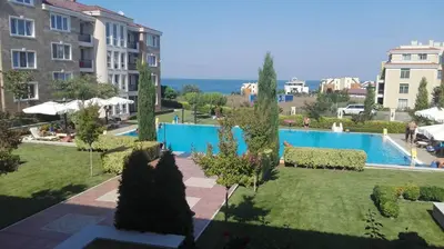 a view of a resort with a swimming pool at Sunset in Chernomorets