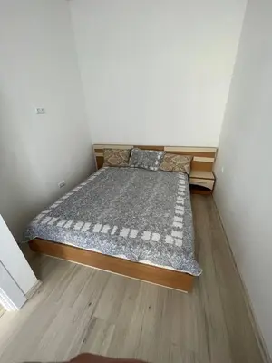 a small bedroom with a bed in a room at Aqva blue apartments in Sunny Beach