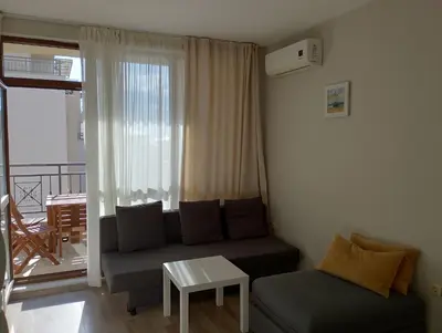 a living room with a couch and a table at Sorrento Sole Mare Studio A Bastet BS in Sveti Vlas