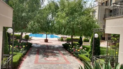 a garden with a tree and a courtyard at Sorrento Sole Mare Studio A Bastet BS in Sveti Vlas