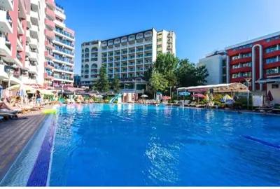a large pool of blue water in a city at Privite apartment hotel Admiral plaza in Sunny Beach