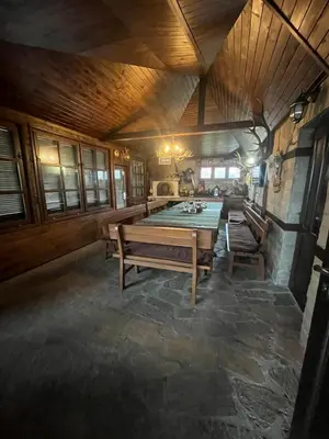 a dining room with a table in a room at Семеен хотел Звезда in Sŭdievo