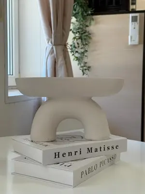 a white statue sitting on top of a box at Dayanas Suite in Varna City