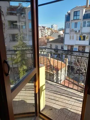 a view from a window of a balcony at Studio 007 с градинка in Burgas City