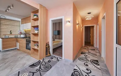 a room with a kitchen and a hallway at Luxury Apartment Saint George Beauty and Style in Sveti Vlas