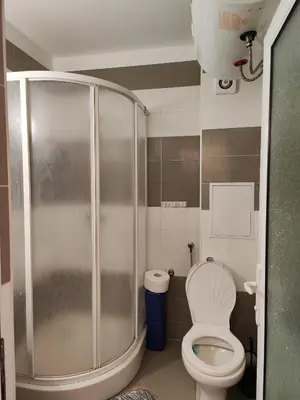 a bathroom with a toilet and a shower at Nev 1 in Burgas City