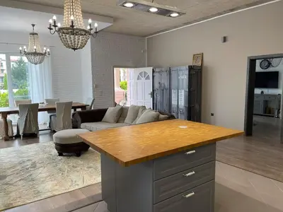 a kitchen and living room with a couch and a table at Luxury Villa in Sozopol in Sozopol