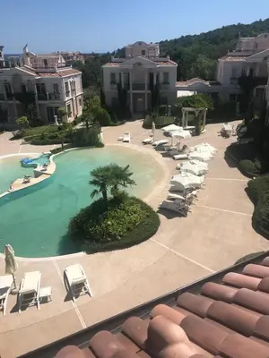 a view of a swimming pool and lounge chairs at Luxury Villa in Sozopol in Sozopol