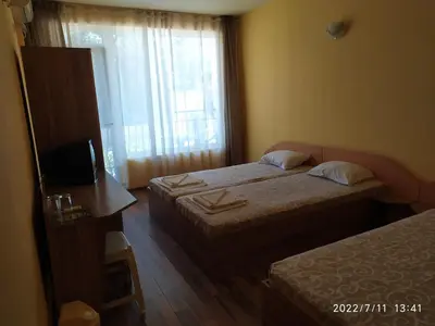 a hotel room with two beds and a window at HOUSEDENz in Chernomorets