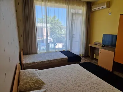 a hotel room with two beds and a window at HOUSEDENz in Chernomorets